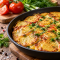 Картофель с заливкой из яиц и сметаны: сытный ужин, который напоминает фриттату